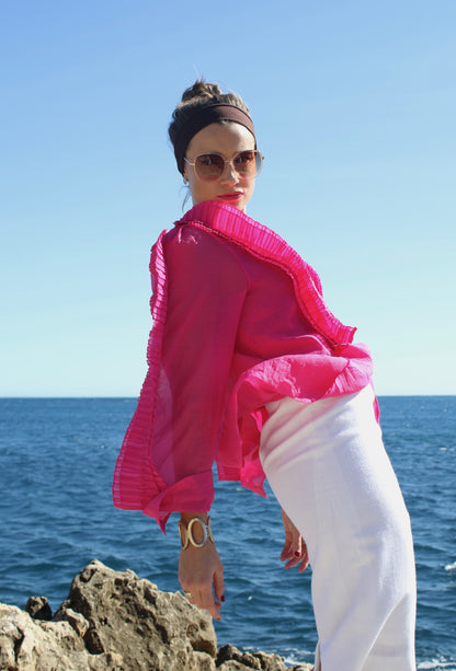 volia atelier | exclusive pre loved fashion | VOLIA white midi pencil skirt paired with a ruffled pink blouse and oversized sunglasses that gives Audrey Hepburn classic vintage vibes