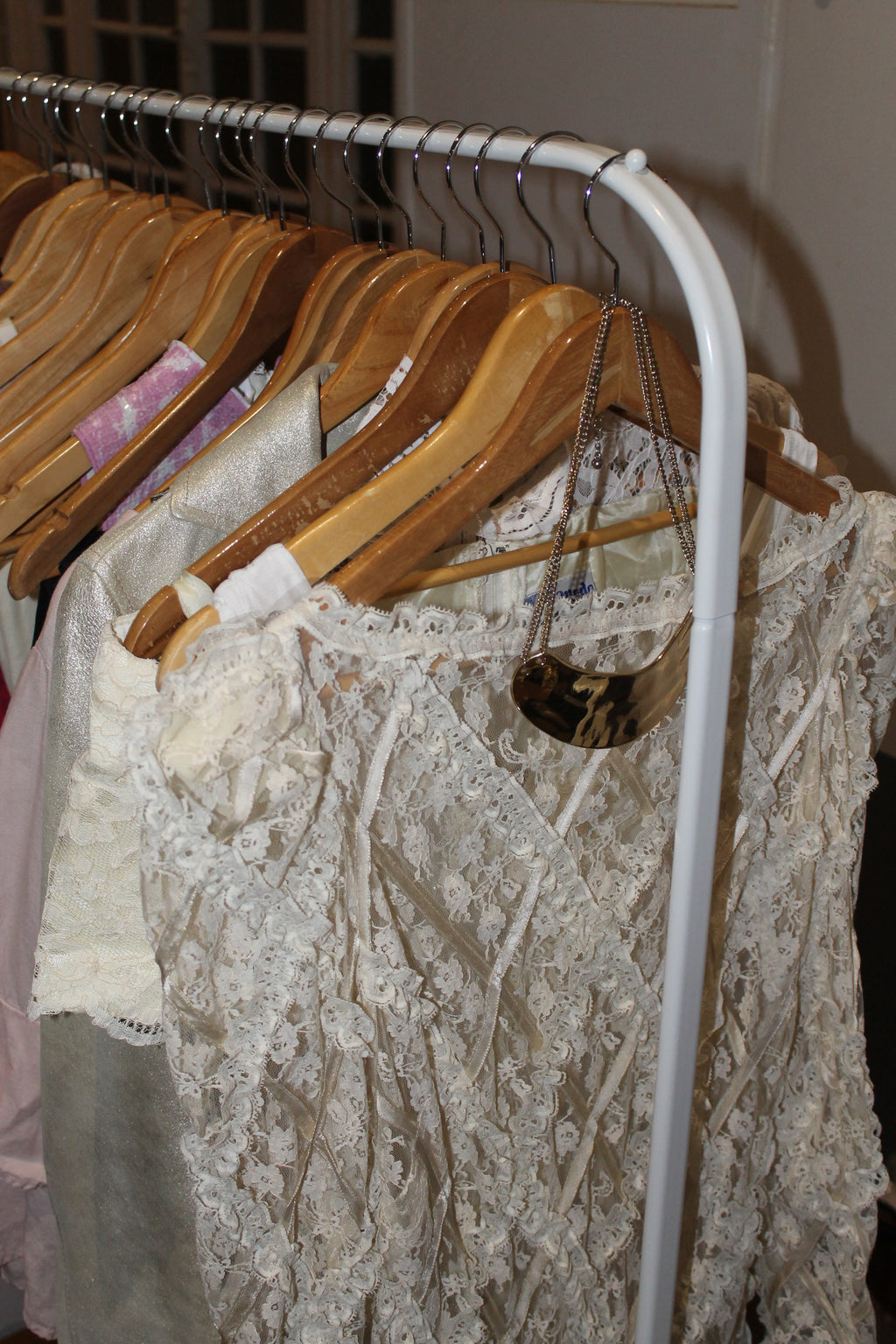 VOLIÀ Atelier - maxi sleek gold necklace paired with ivory midi lace dress. Seen on Paris Runway