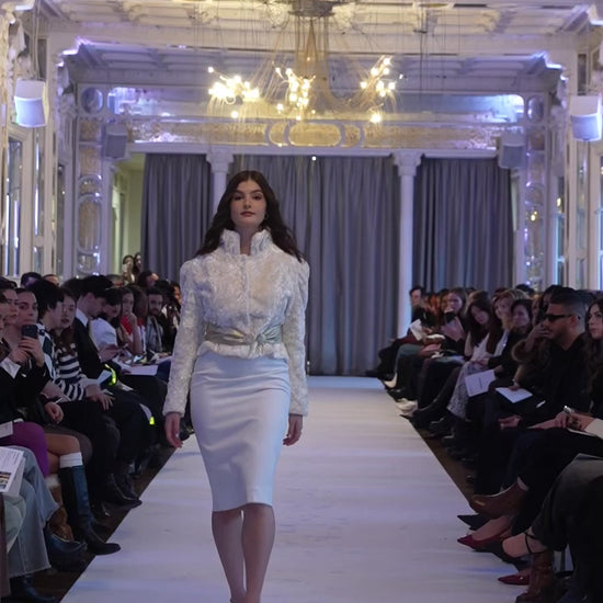 volia atelier | exclusive pre loved fashion | classic white pencil skirt styled with a gold belt and a fitted white crushed velvet jacket on Paris runway 