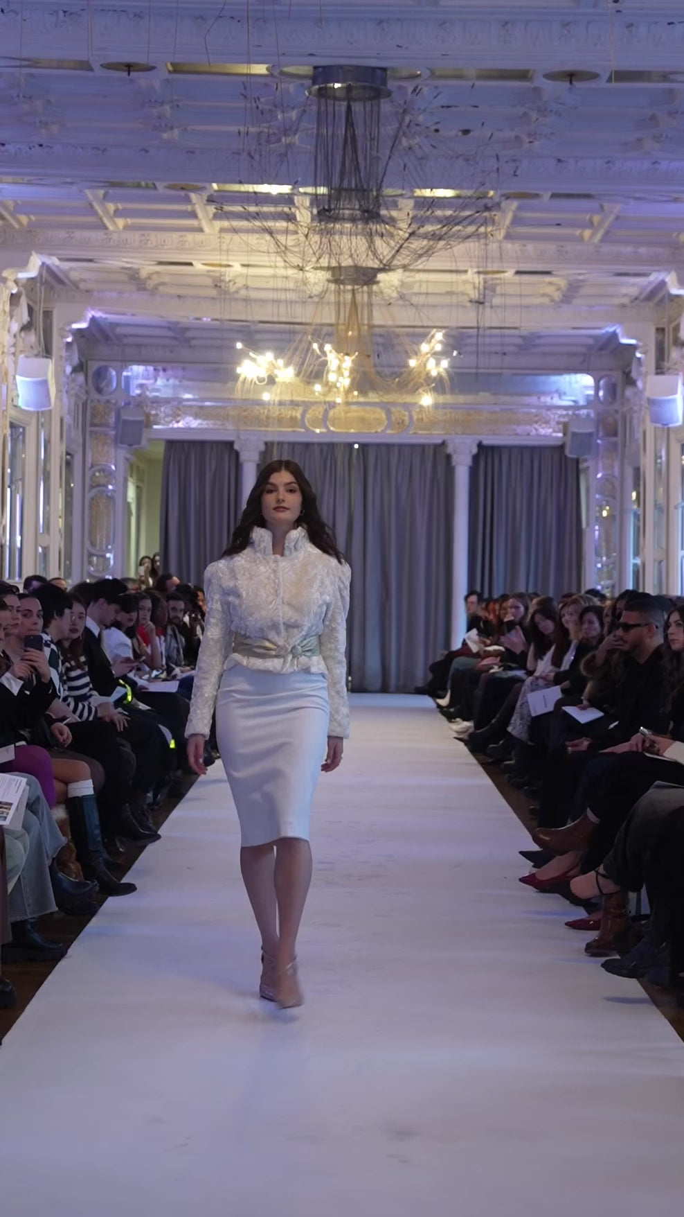 volia atelier | exclusive pre loved fashion | classic white pencil skirt styled with a gold belt and a fitted white crushed velvet jacket on Paris runway 