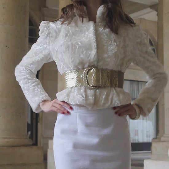 VOLIÀs founder in the Aurora belt styled with a monochrome white look, creating a modern touch of the elegant business woman