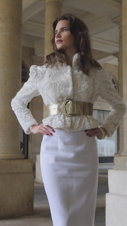 VOLIÀs founder in the Aurora belt styled with a monochrome white look, creating a modern touch of the elegant business woman